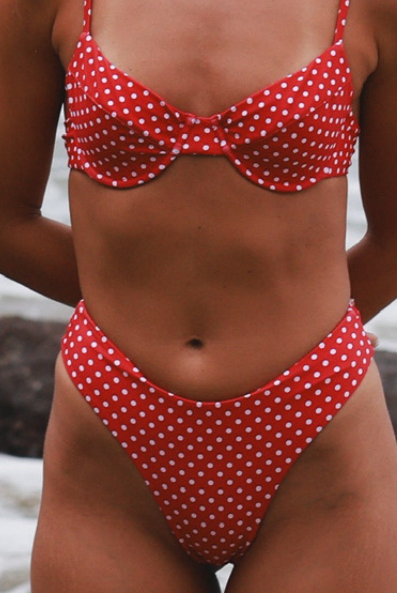 Red polka dot bikini close-up.