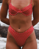 Red polka dot bikini close-up.