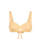 Haut de bikini jaune avec un nœud sur fond blanc